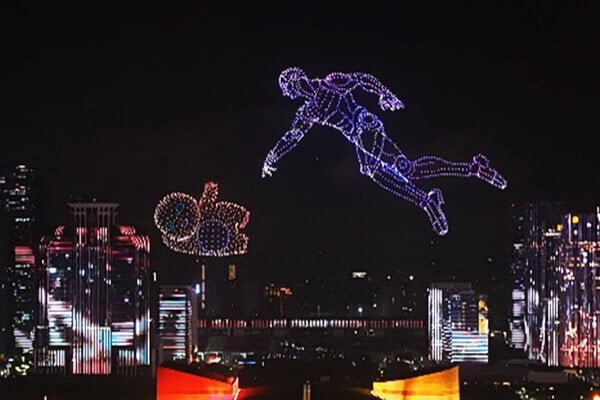 Contacting a Drone Show Provider A person on a laptop contacting a drone show provider