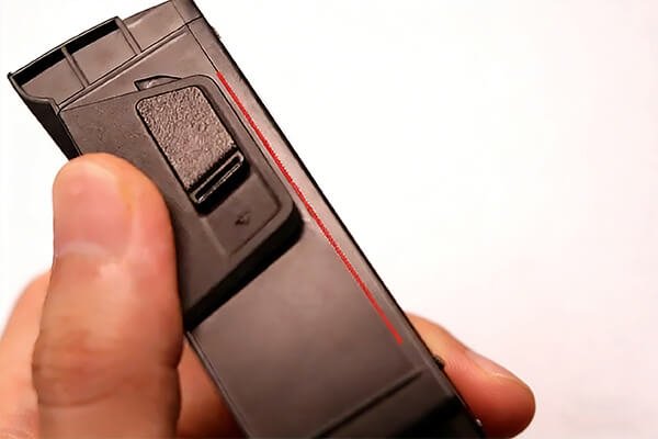DJI Drone Battery Release Mechanism A close-up diagram showing where to press on a DJI-style drone battery