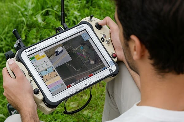 A diagram showing the components of a UAS: the UAV, ground controller, and data link