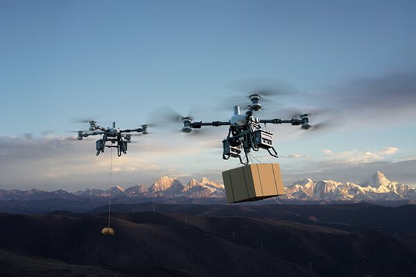 A DJI FlyCart drone airlifting a heavy container
