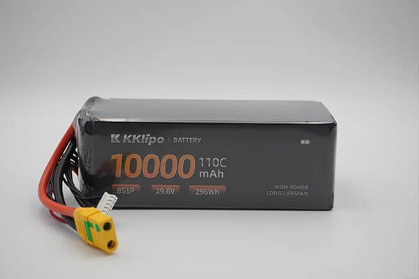 A side-by-side comparison of two batteries with different densities: one long and thin, the other short and wide