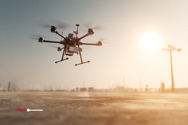 Heat Performance Visualization A drone flying over a desert landscape with a heat map overlay showing cool battery temperatures.