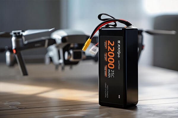 A quality control inspector examining battery cells in a factory setting