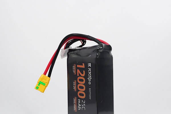 A simple diagram showing six battery cells connected in a series circuit, with arrows indicating the flow of electricity and the cumulative voltage.