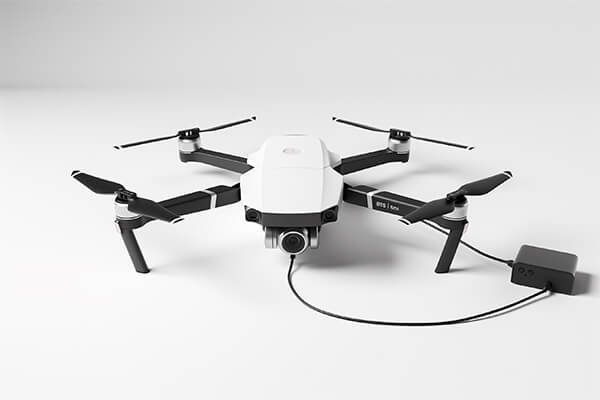 A high-power 100W PD charger connected to a multi-battery drone charging hub